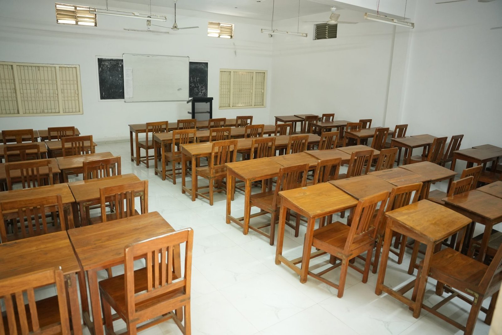 Rows of desks in a college classroom