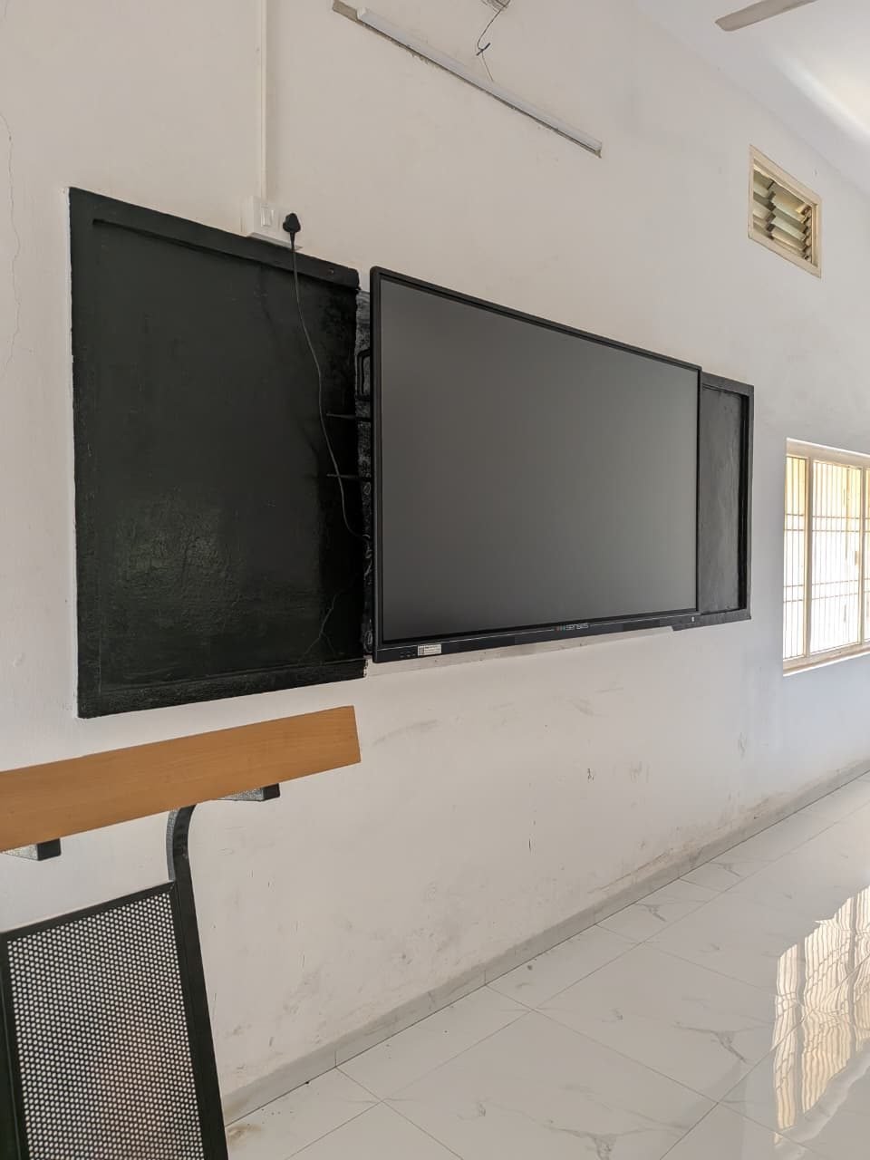 Classroom fitted with a wall-mounted smart display