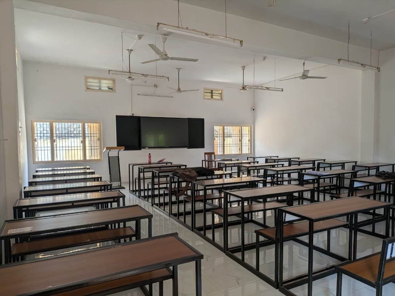Classroom with a smart board and student desks