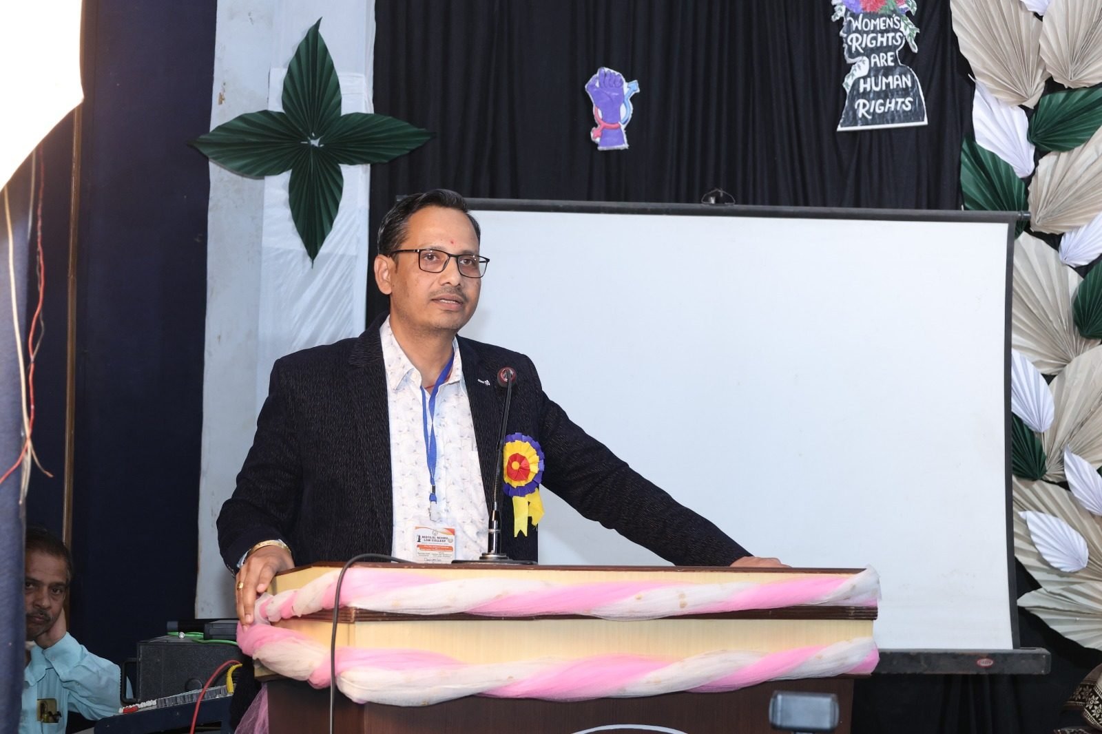 Speaker addressing attendees at a college seminar