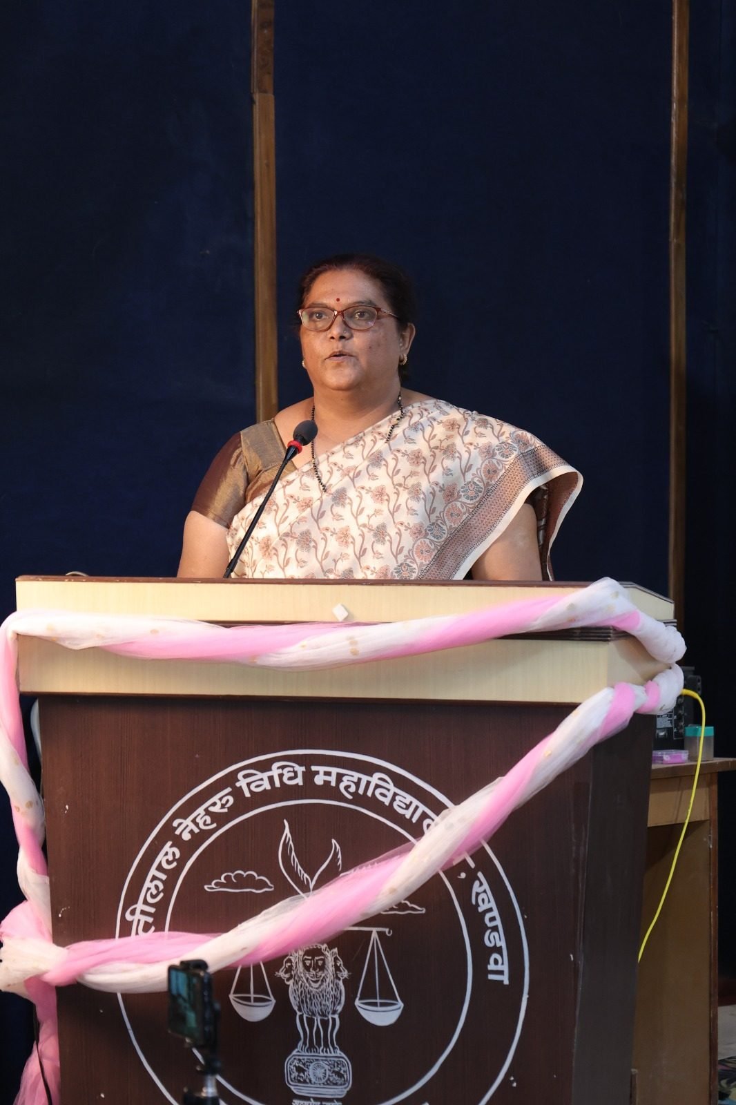 Speaker addressing attendees at a college seminar