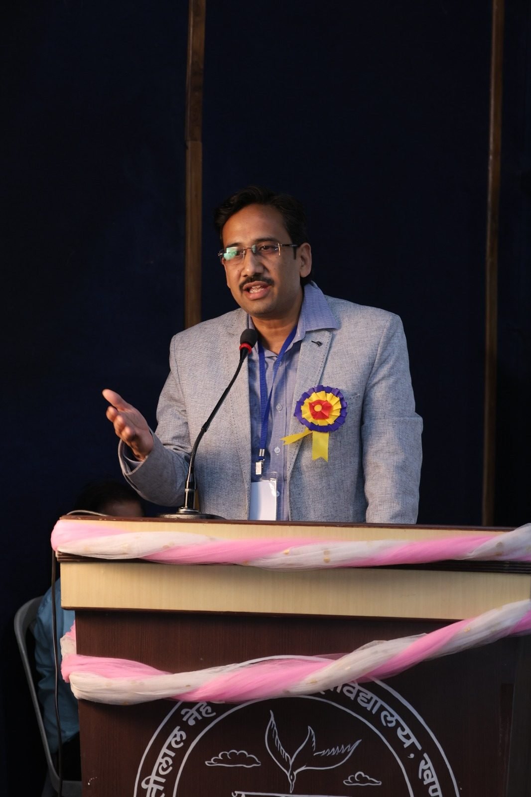 Speaker addressing attendees at a college seminar