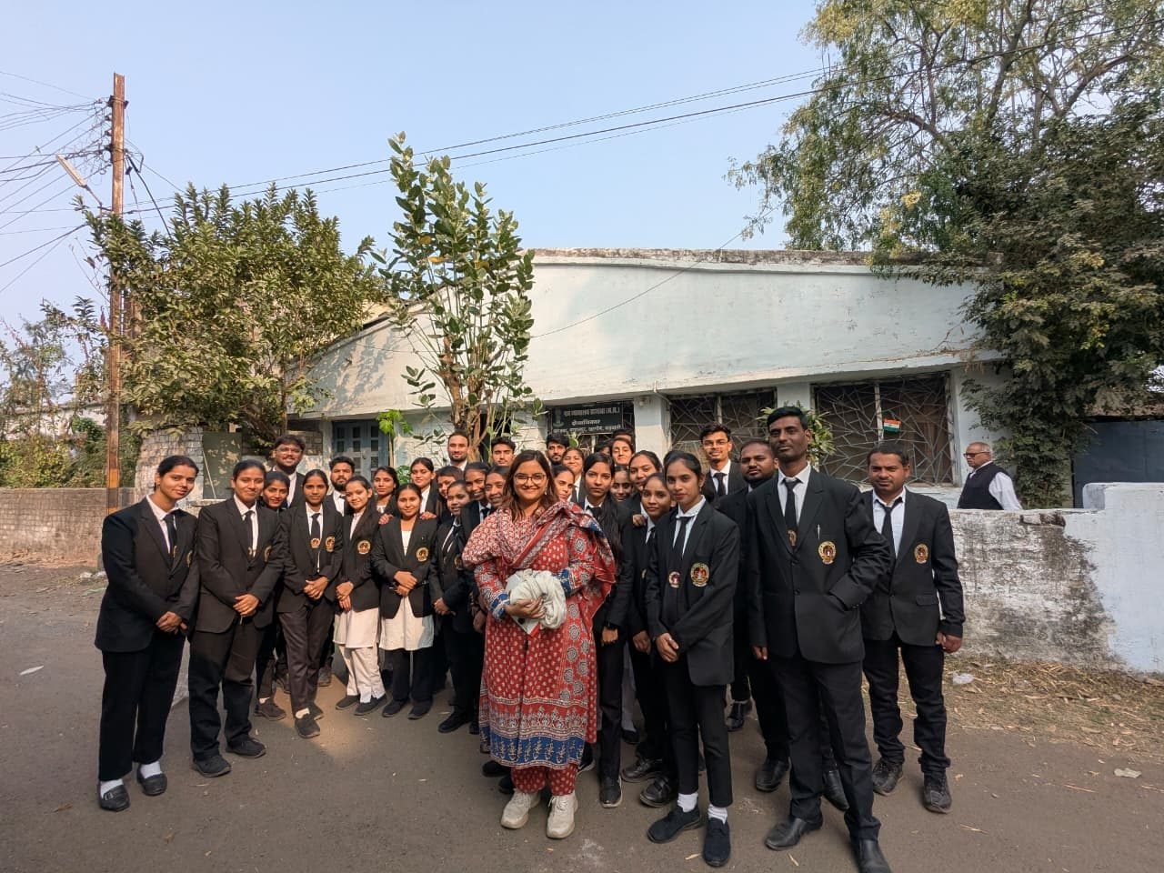 Group photograph of students and staff at a college function